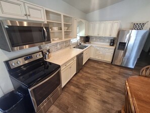 Coffee/tea maker, fridge, microwave, oven