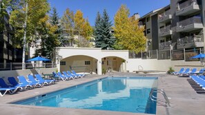 Outdoor pool, a heated pool - Luxury Condo w/ FREE WiFi, Parking, Heated Pool, Hot Tubs, Skier Shuttles (Avon)