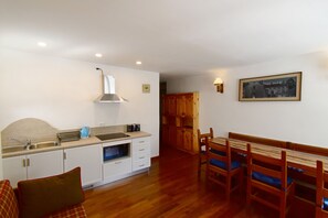Fridge, microwave, electric kettle, cookware/dishes/utensils