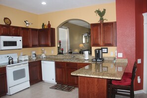Enjoy cooking in this well-equipped kitchen with a microwave, toaster, and coffee maker.