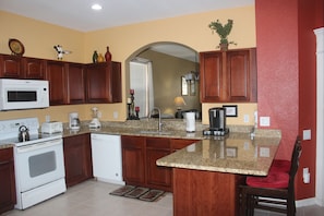 Enjoy cooking in this well-equipped kitchen with a microwave, toaster, and coffee maker.