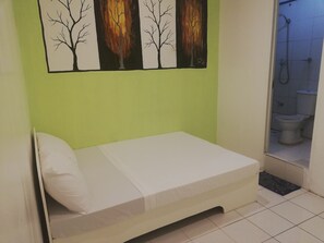 Standard Room | Bed sheets - Dormitels.ph Ermita (Manila)