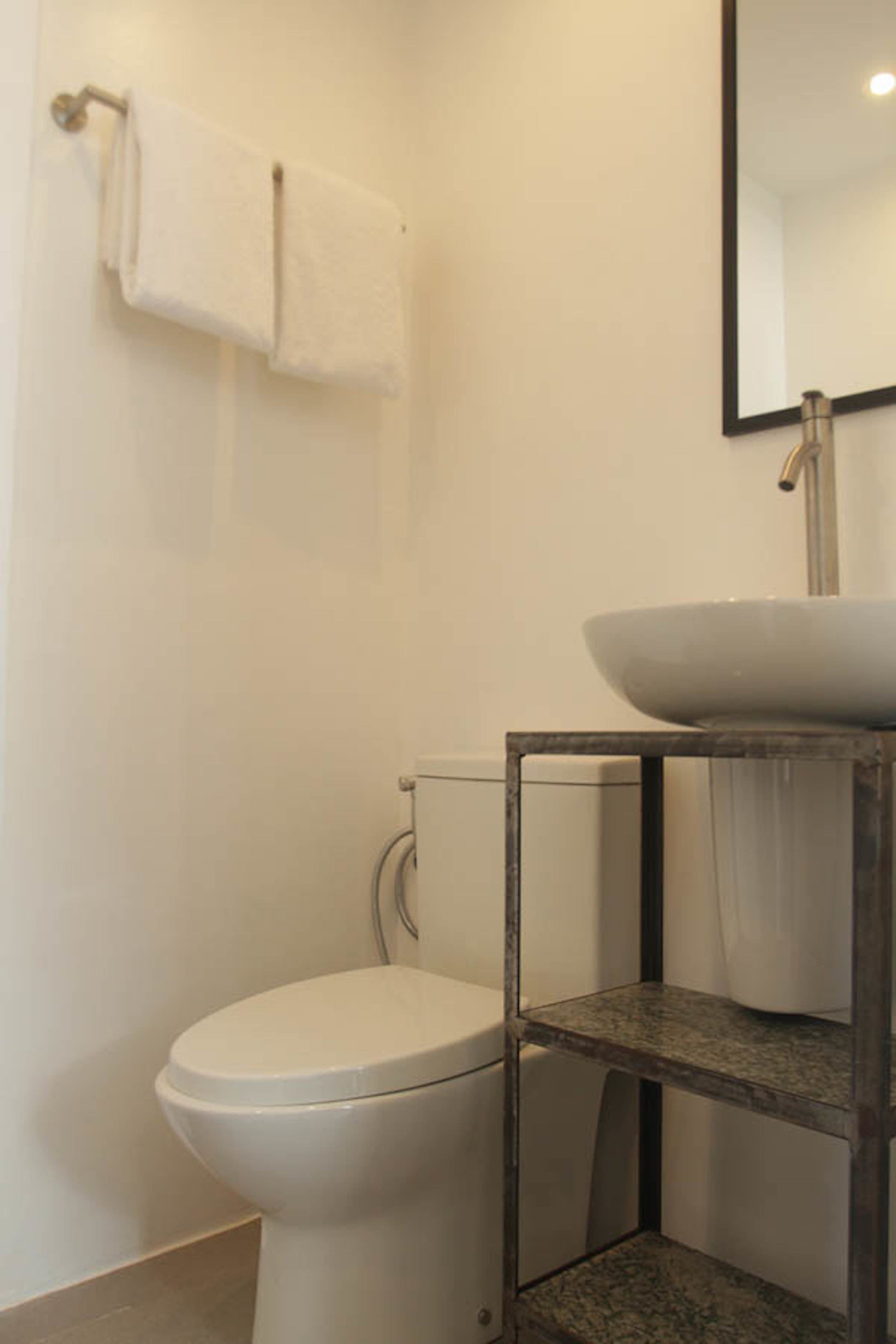 studio | bathroom | shower, rainfall showerhead, bidet, towels