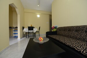 Family Apartment, Multiple Beds, Non Smoking | Living area | 32-inch LCD TV with satellite channels, TV