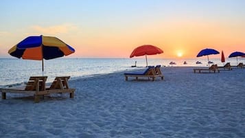 On the beach, sun-loungers, beach towels