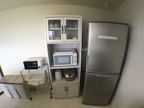 A compact kitchen with a microwave, a toaster, and a refrigerator. - L.O.A resort (Okinawa)