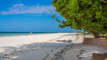 On the beach, sun loungers, beach towels