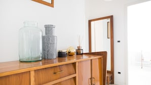 A wooden cabinet with drawers and a mirror.