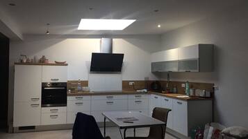 Apartment | Private kitchen | Full-size fridge, oven, stovetop, cookware/dishes/utensils