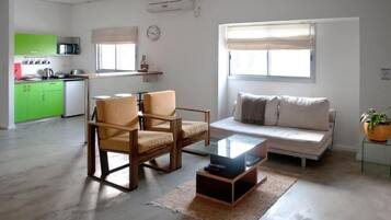 Premium Apartment | Living area | 32-inch flat-screen TV with cable channels, TV