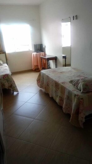 Desk, blackout curtains, iron/ironing board, rollaway beds