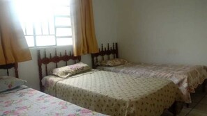 Desk, blackout curtains, iron/ironing board, rollaway beds