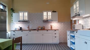 Full-sized fridge, microwave, stovetop, electric kettle