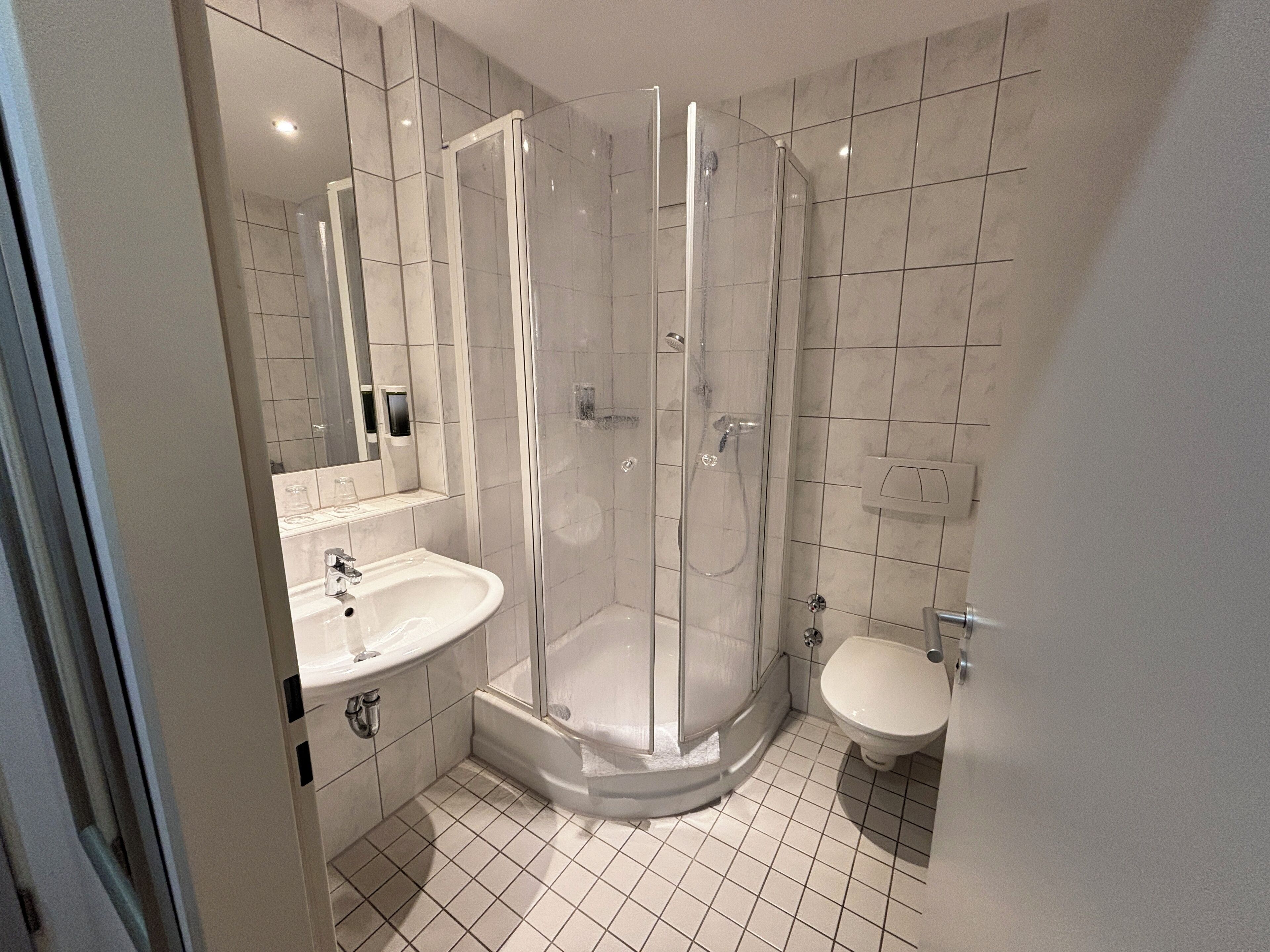comfort triple room | bathroom | shower, hair dryer, towels
