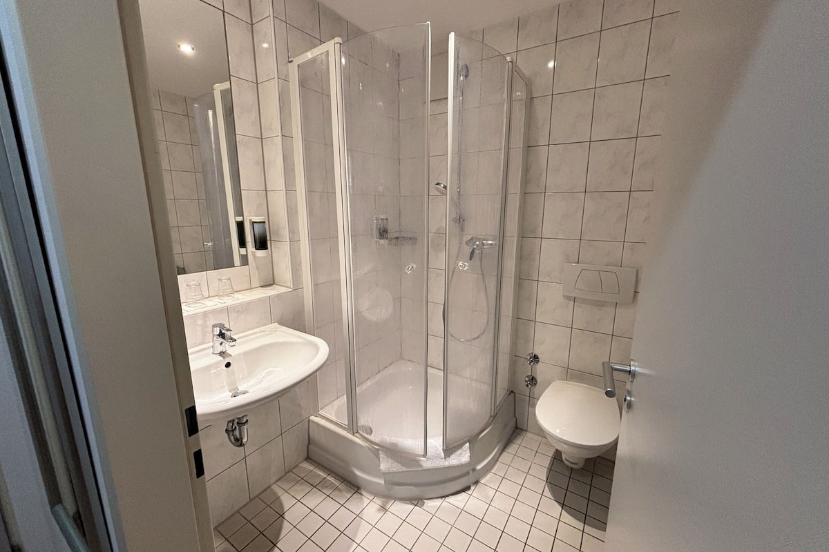 comfort triple room | bathroom | shower, hair dryer, towels