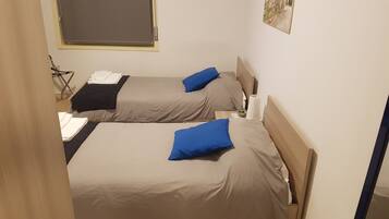 Twin Room, 2 Twin Beds, Private Bathroom | Desk, blackout drapes, free WiFi, bed sheets