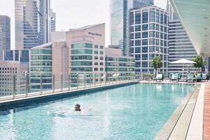 Outdoor pool, open 6:00 AM to 10:00 PM, pool loungers