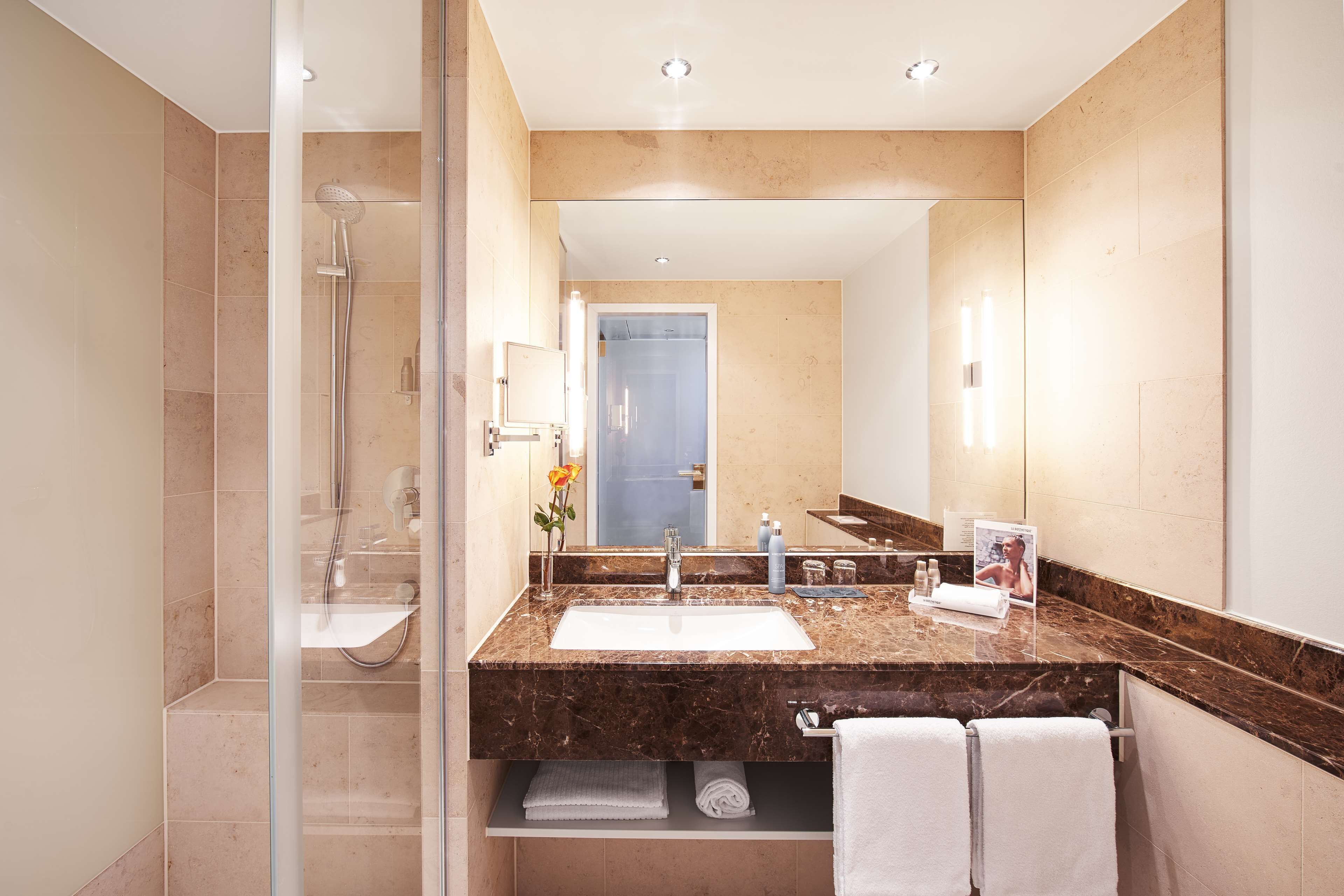 shower, designer toiletries, hair dryer, slippers