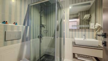 Shower, free toiletries, hair dryer, slippers