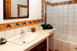 Combined shower/bathtub, hair dryer, towels, soap