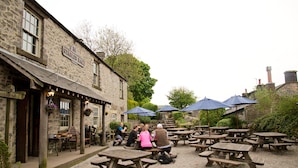 A stone building with a sign reading "Stables Bar". - Monsal Head Hotel (Buxton)