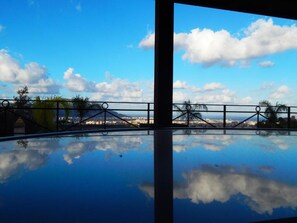 Seasonal outdoor pool, open 10:00 AM to 6:00 PM, pool loungers