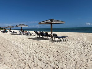 On the beach, sun-loungers, beach towels - SEA SONG Direct Oceanfront, 2 Kings, 2Bath, Beautiful Ocean Views! (Providenciales)