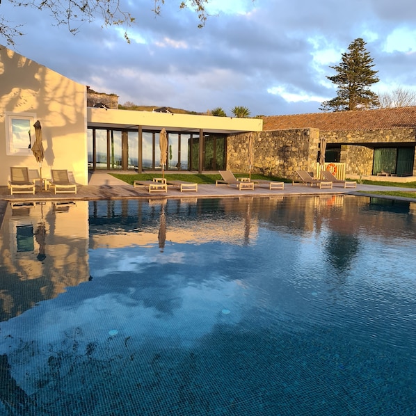 Indoor pool, outdoor pool, open 9:00 AM to midnight, pool umbrellas