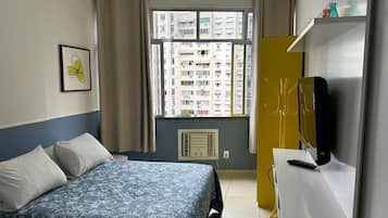 Apartamento | Frigobar, ferros/tábuas de passar roupa, Wi-Fi de cortesia