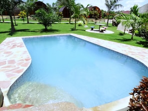 Outdoor pool, open 9:00 AM to 7:00 PM, pool umbrellas, pool loungers