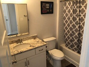 Combined shower/bathtub, hair dryer, towels, soap