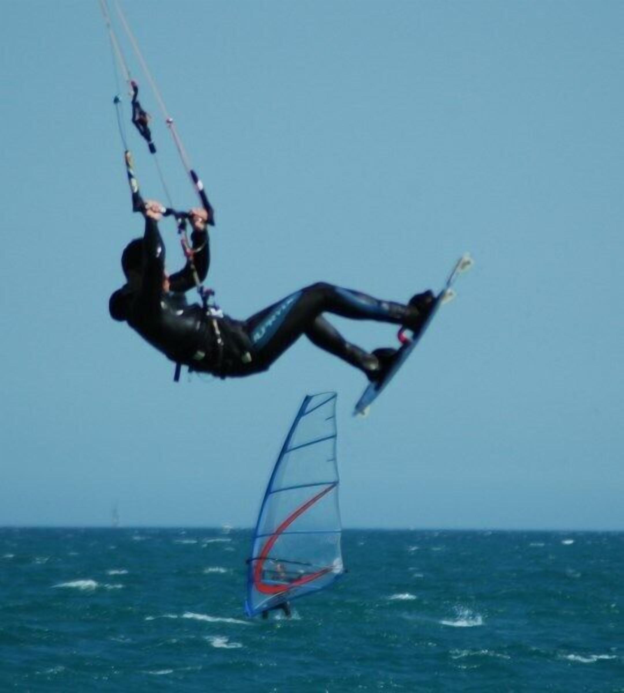 A person windsurfing in the ocean.