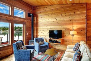 Luxury 2 Bedroom Suite, Queen Beds, Waterfront, View Deck | Living room | Flat-screen TV, fireplace