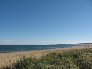 A beach with clear skies and calm waters.