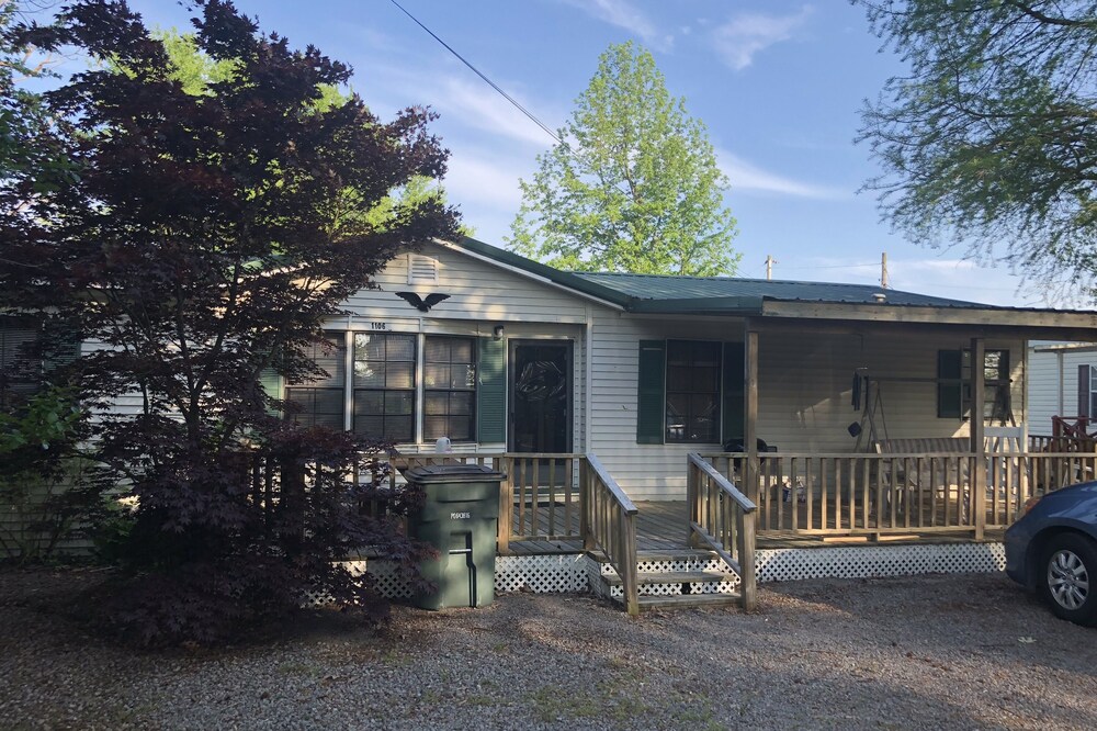 Fish cleaning station, screened back porch, covered front porch, fire pit.