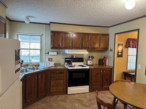 Fridge, microwave, oven, stovetop - Fish cleaning station, screened porch, covered front porch, fire pit, 3 BR    (Hornbeak)