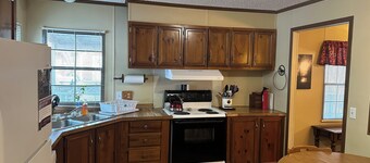 Fish cleaning station, screened porch, covered front porch, fire pit, 3 BR   