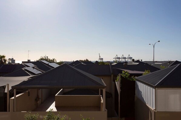 A residential area with multiple houses, each featuring a sloped roof and a small attached garage. - Fremantle Heaven Apartment (Fremantle)