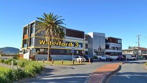 A modern building with a sign reading "Waterford 3". - Waterford Apartment 3 (South West Rocks)