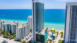 A high-rise hotel with a pool area and a view of the ocean. - Private Ocean Condos - Hyde Beach Resort (Hollywood)