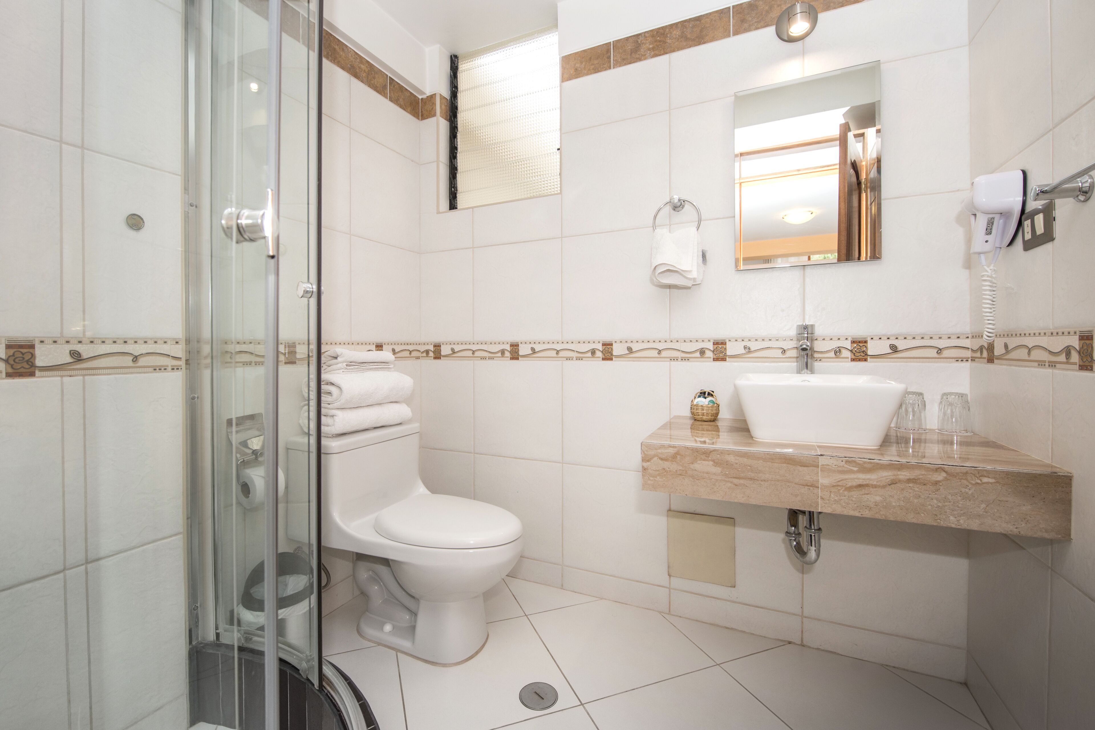 superior double room | bathroom | shower, hair dryer, towels