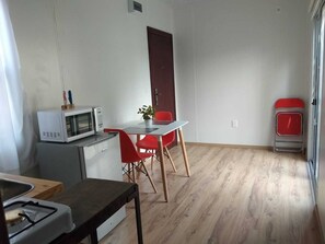 Fridge, microwave, stovetop, dining tables