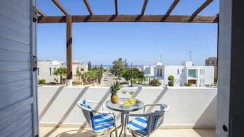 Apartamento, 2 quartos, 2 banheiros | Opções para refeição ao ar livre