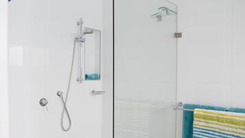 Shower, hair dryer, towels, toilet paper