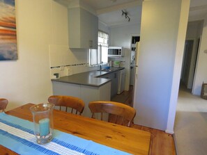 House, 3 Bedrooms (1 Queen, 2 Single, 1 Tri-bunk) | Private kitchen | Full-sized fridge, microwave, oven, stovetop
