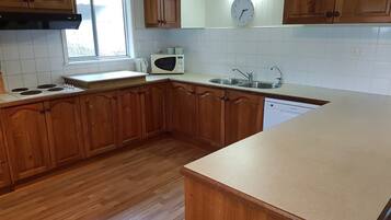 House, 4 Bedrooms | Private kitchen | Full-sized fridge, microwave, oven, stovetop