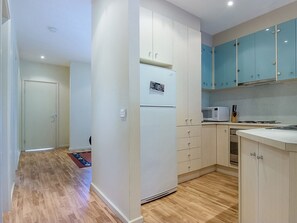 Apartment, 2 Bedrooms (1 Queen, 1 Tri-bunk) | Private kitchen | Full-sized fridge, microwave, oven, stovetop - 121 at The Waves (Cowes)