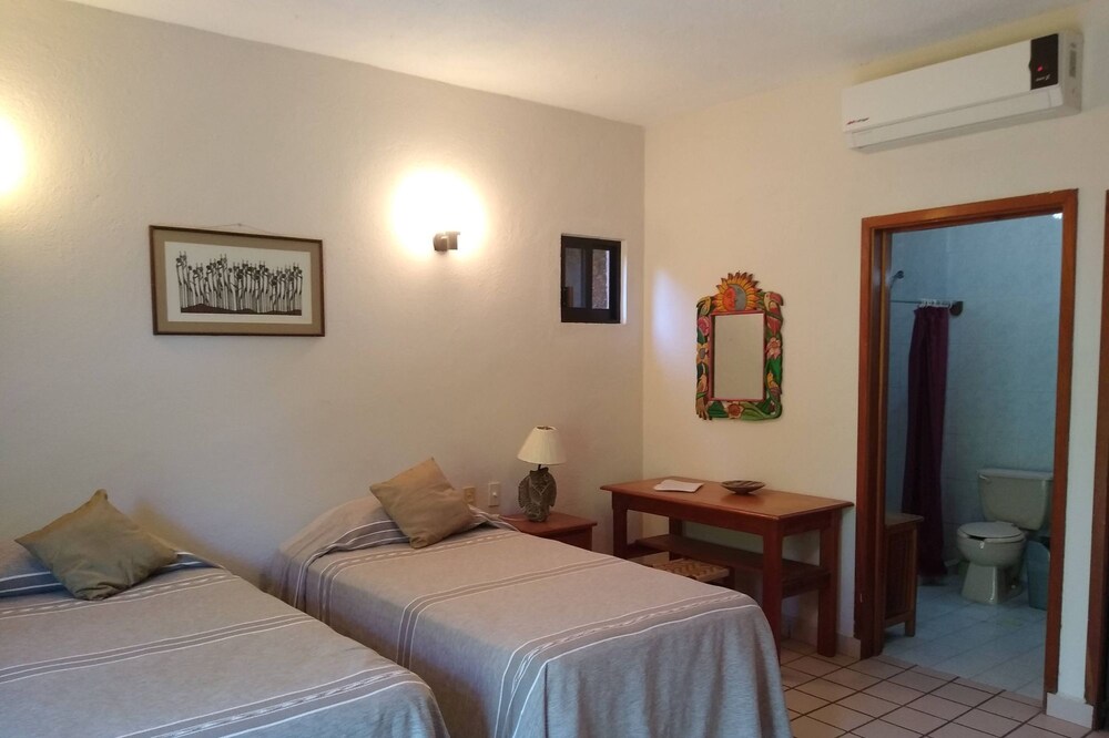 Spacious room in family guesthouse walking distance to La Ropa beach