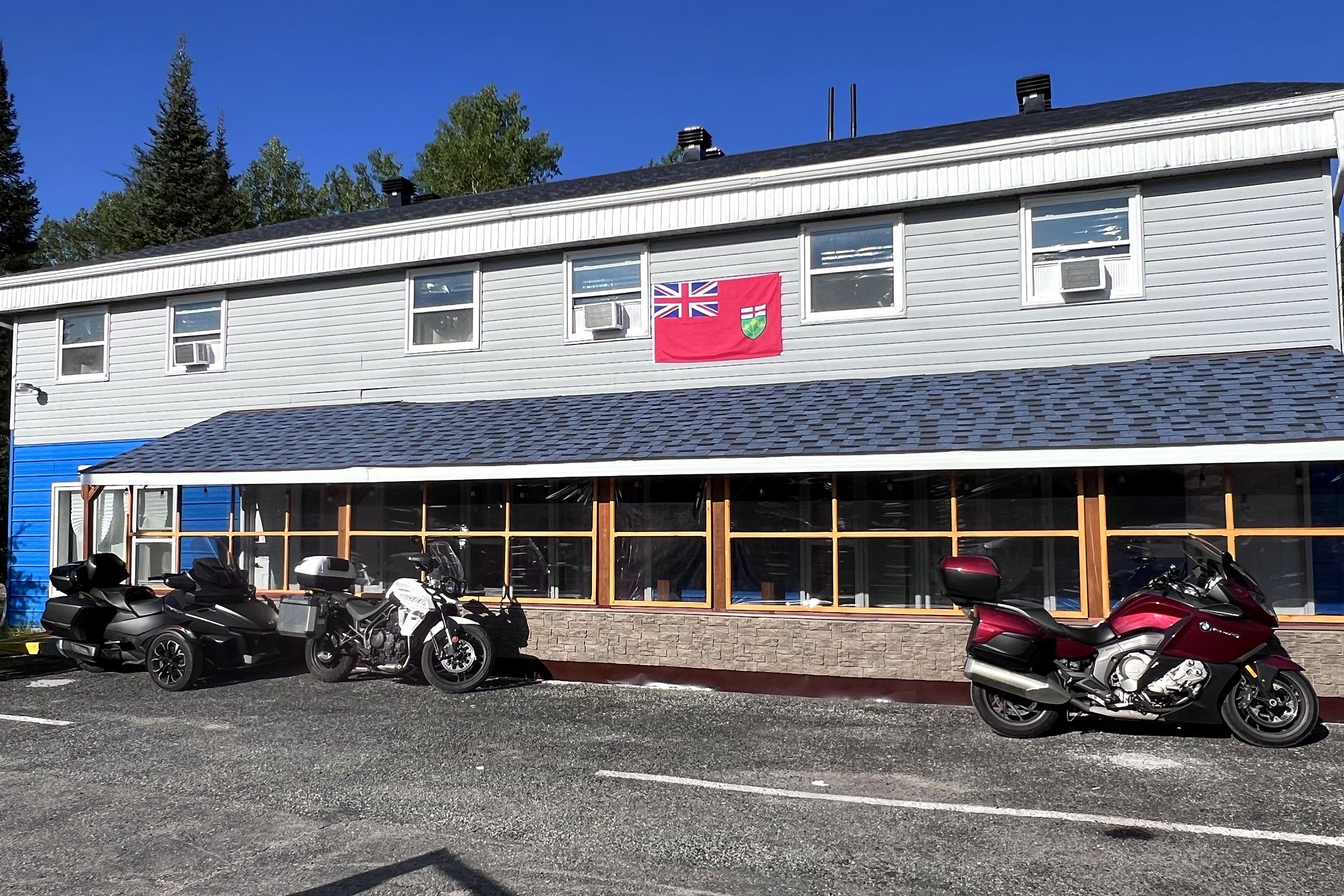 A building with a row of windows and a flag.