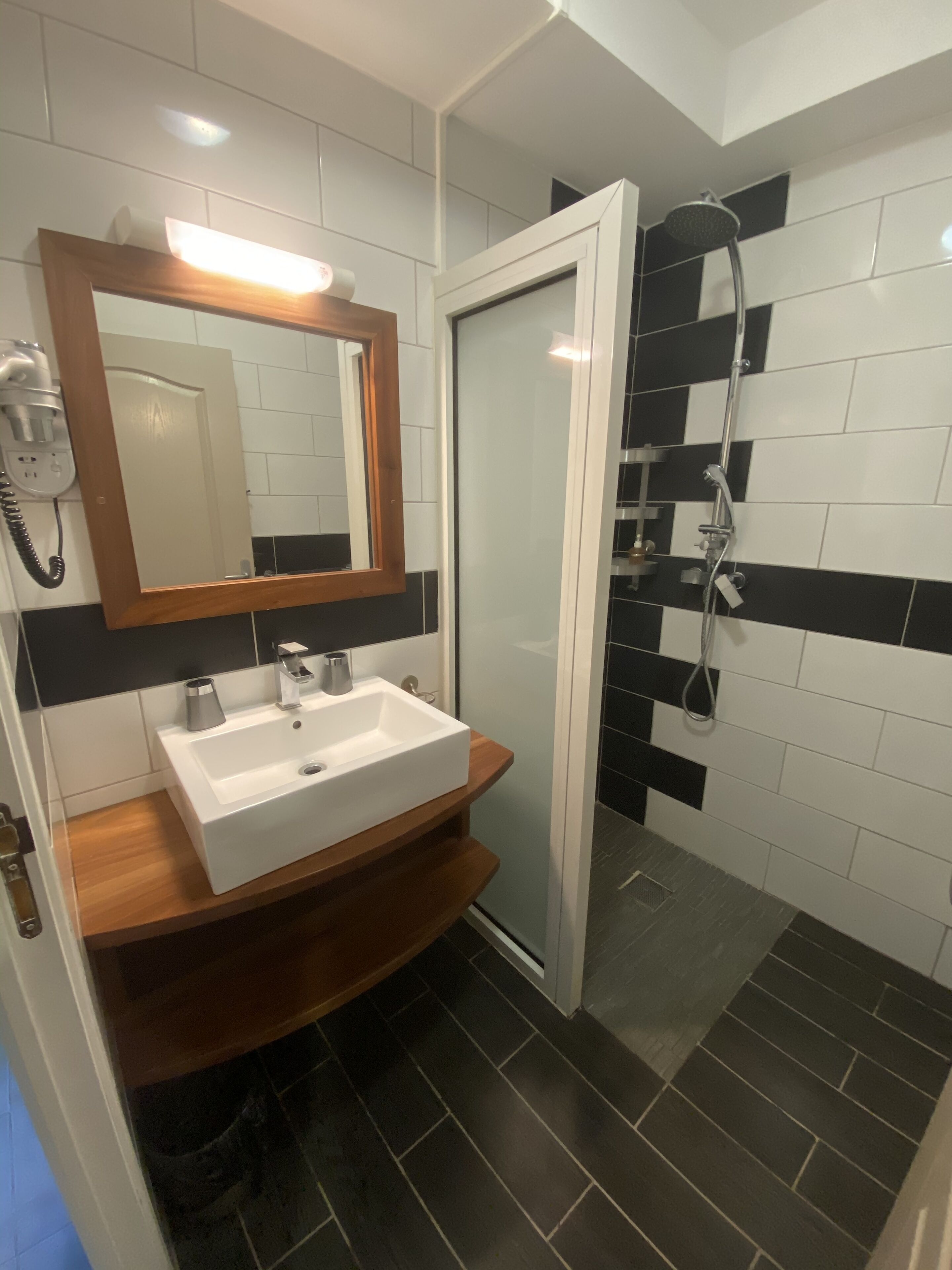 economy double room | bathroom | shower, free toiletries, hair dryer, towels